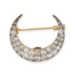 AN ANTIQUE DIAMOND CRESCENT MOON BROOCH in yellow gold and silver, designed as a crescent moon se...