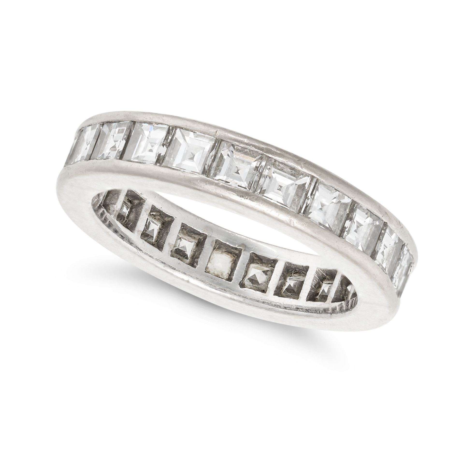 A DIAMOND FULL ETERNITY RING in white gold, set all around with a row of carre cut diamonds, the ...