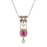 AN ANTIQUE RUBY AND DIAMOND PENDANT NECKLACE in yellow gold and silver, the pendant designed as a...