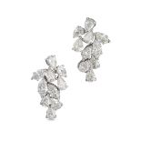 A PAIR OF DIAMOND EARRINGS in white gold, each set with a cluster of pear and marquise brilliant ...