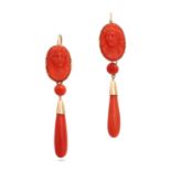 A PAIR OF ANTIQUE CORAL CAMEO DROP EARRINGS in 14ct yellow gold, each set with a carved coral cam...