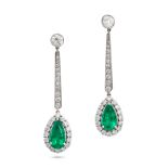 A PAIR OF EMERALD AND DIAMOND DROP EARRINGS in platinum and 18ct white gold, each set with a row ...