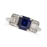 A SAPPHIRE AND DIAMOND RING in platinum, set with an octagonal step cut sapphire of approximately...