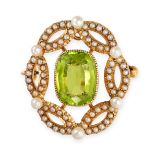 AN ANTIQUE EDWARDIAN PERIDOT AND PEARL BROOCH / PENDANT in yellow gold, set with a cushion cut pe...