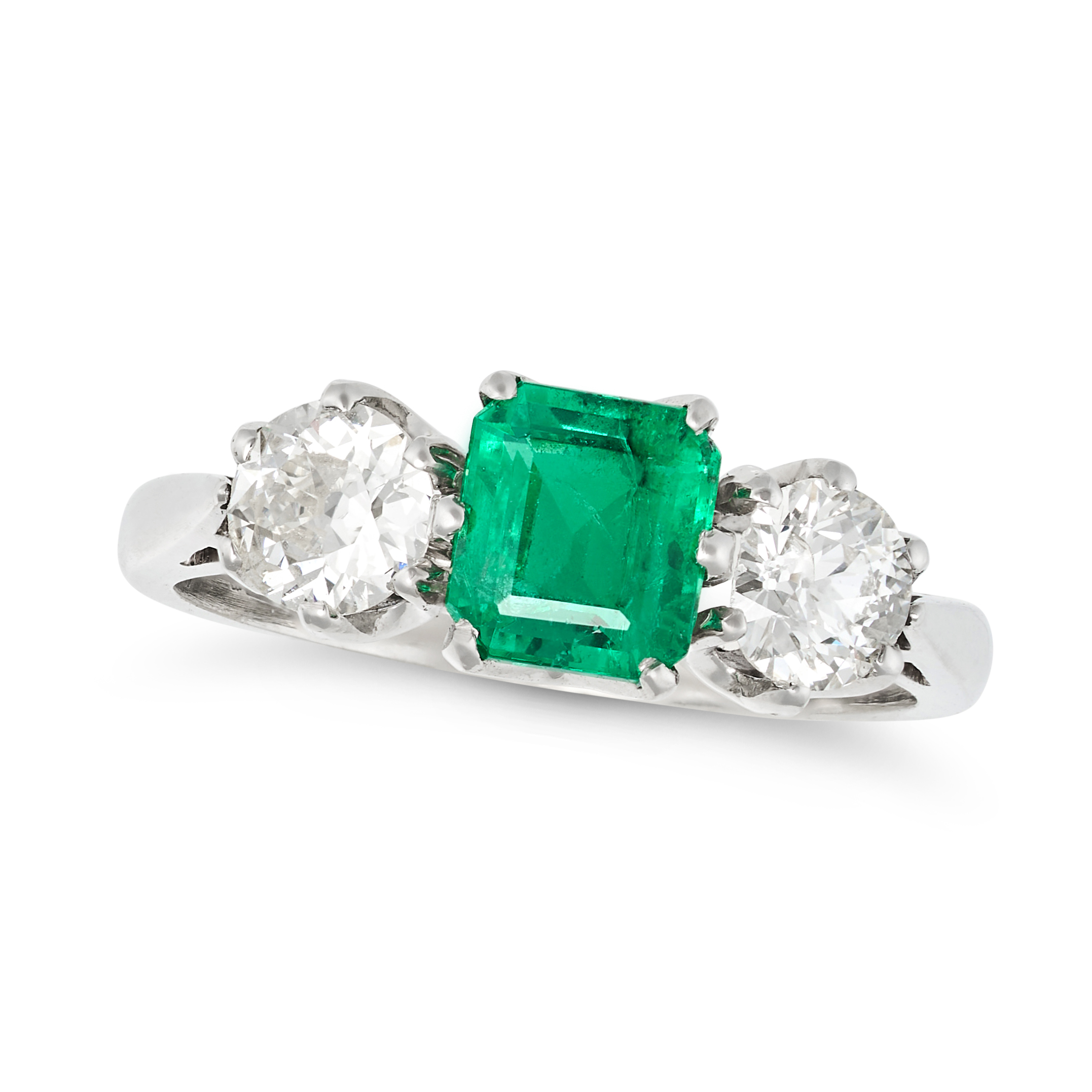 AN EMERALD AND DIAMOND THREE STONE RING in platinum, set with an octagonal step cut emerald of 1....