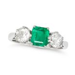 AN EMERALD AND DIAMOND THREE STONE RING in platinum, set with an octagonal step cut emerald of 1....