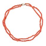 A TWO ROW CORAL BEAD NECKLACE comprising two rows of polished coral beads, no assay marks, 38.0cm...