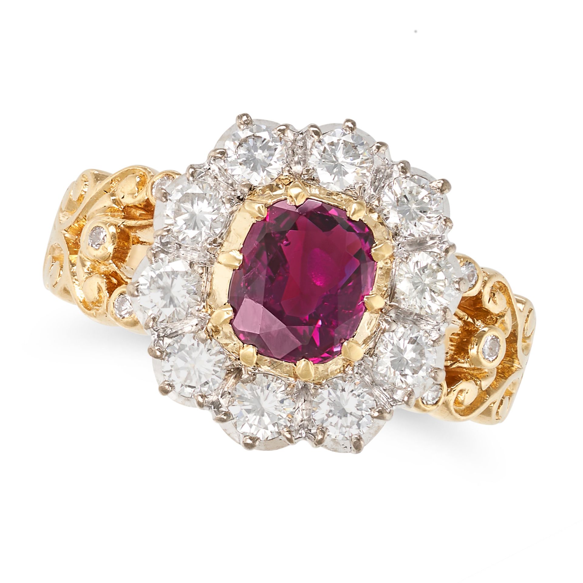 A RUBY AND DIAMOND CLUSTER RING in yellow gold, set with a cushion cut ruby of approximately 0.96...