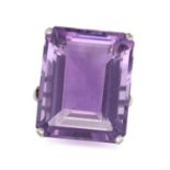 AN AMETHYST RING in 18ct white gold, set with a rectangular step cut amethyst of approximately 27...