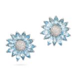 A PAIR OF BLUE TOPAZ AND DIAMOND FLOWER EARRINGS in 18ct white gold, each designed as the head of...