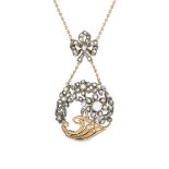 A DIAMOND CORNUCOPIA NECKLACE in 14ct yellow gold and silver, the pendant designed as a cornucopi...