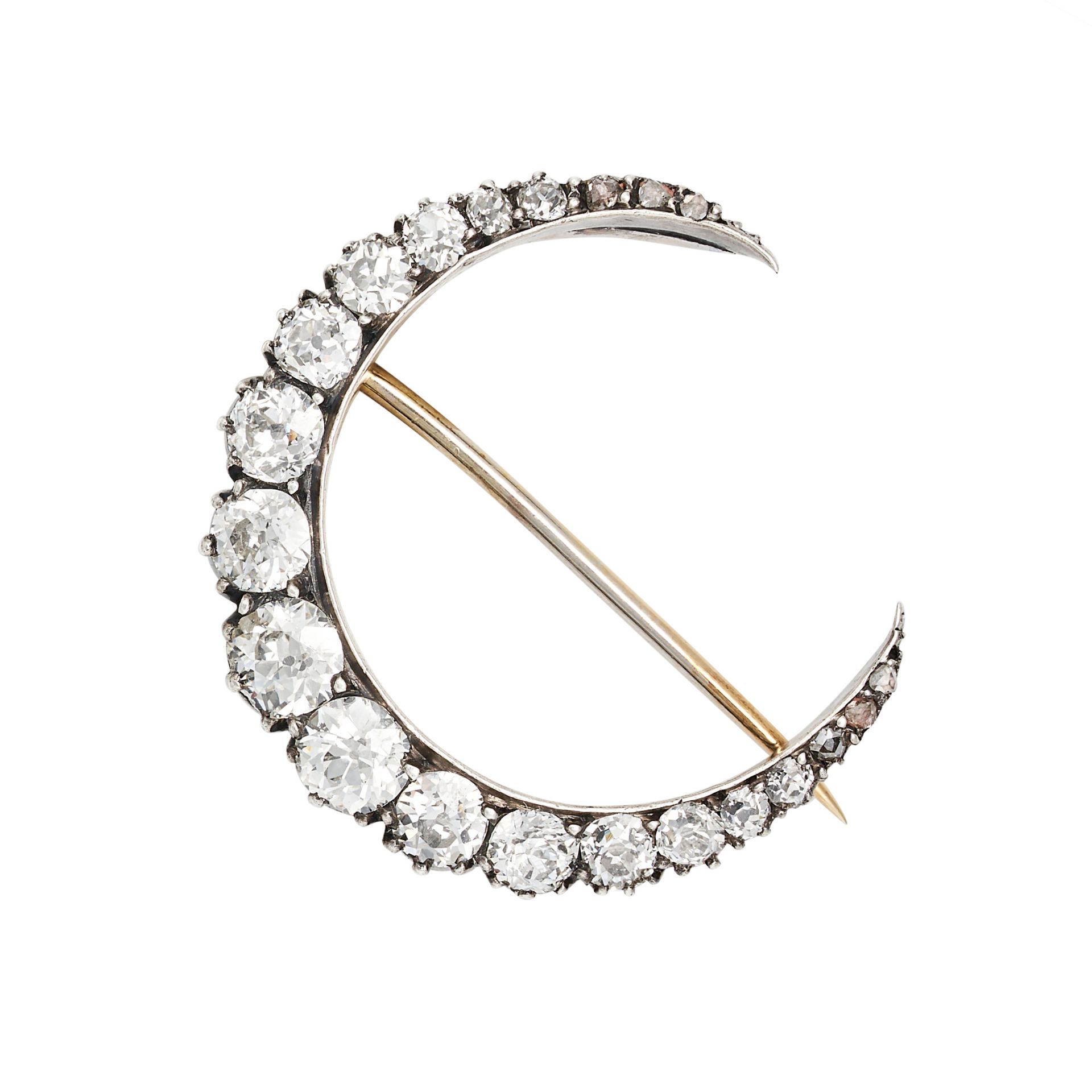 AN ANTIQUE VICTORIAN DIAMOND CRESCENT MOON BROOCH in yellow gold and silver, designed as a cresce...
