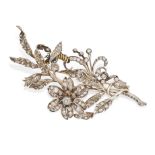 AN ANTIQUE FRENCH DIAMOND AND ENAMEL EN TREMBLANT BROOCH in yellow gold and silver, designed as a...