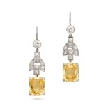 A PAIR OF YELLOW SAPPHIRE AND DIAMOND DROP EARRINGS in platinum, each set with a round brilliant ...
