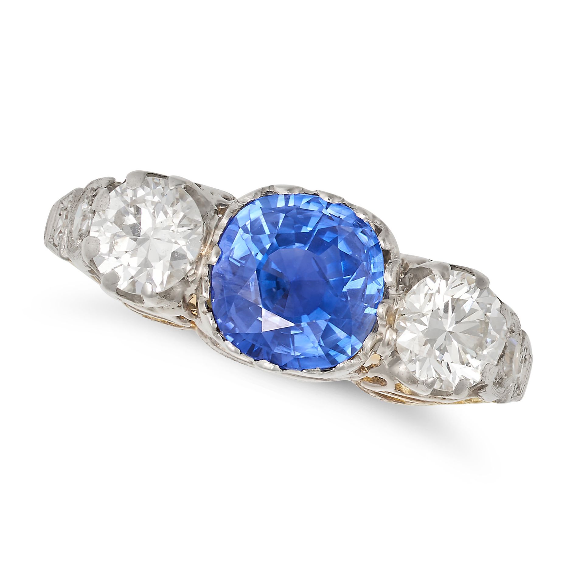 A CEYLON NO HEAT SAPPHIRE AND DIAMOND THREE STONE RING in 18ct yellow and white gold, set with a ...