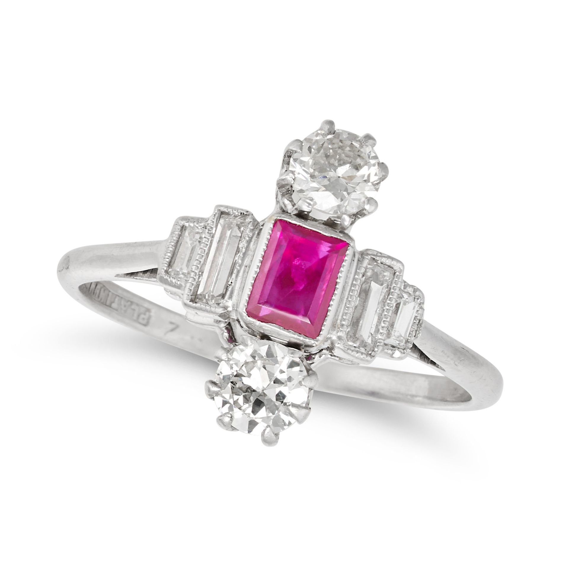 A RUBY AND DIAMOND DRESS RING in platinum, set with a rectangular step cut ruby between two trans...
