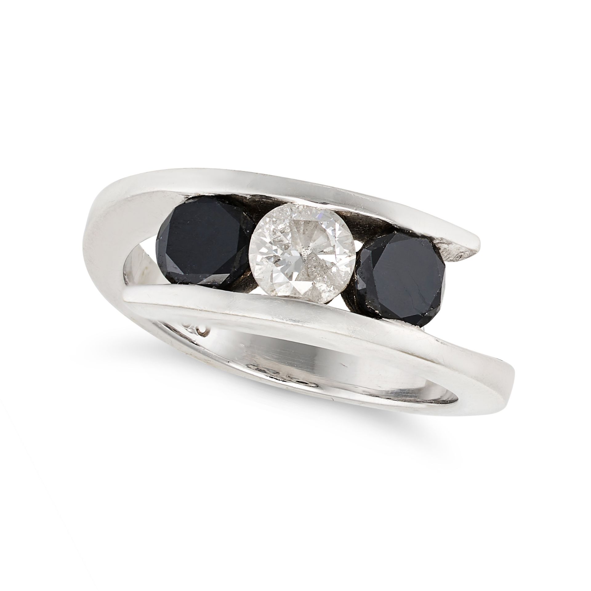 A THREE STONE BLACK AND WHITE DIAMOND CROSSOVER RING in 14ct white gold, set with round brilliant...