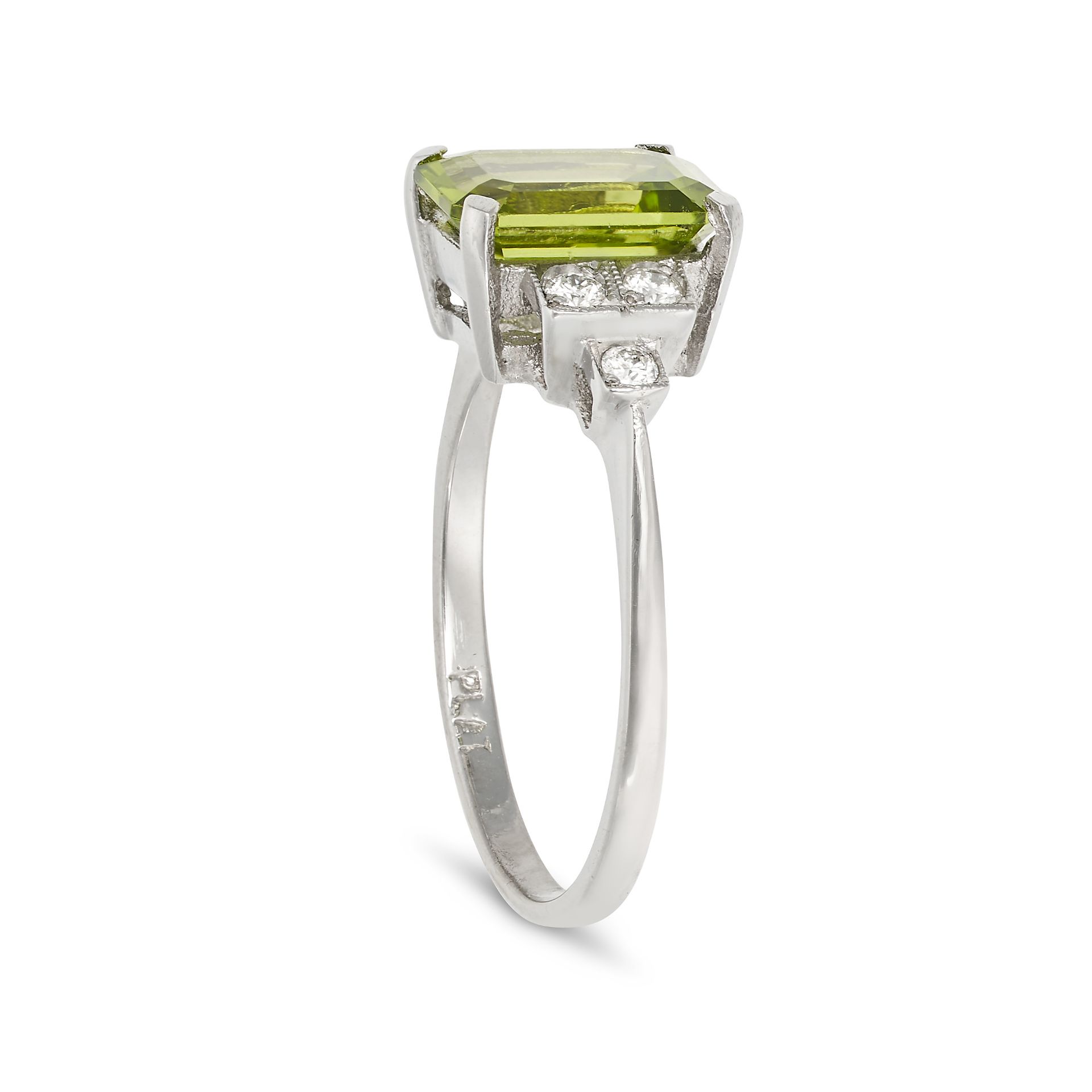 A PERIDOT AND DIAMOND RING in platinum, set with an octagonal step cut peridot of approximately 2... - Image 2 of 2