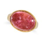 A PINK TOURMALINE RING in 22ct yellow gold, set with an oval cabochon cut pink tourmaline of appr...