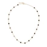 A BLACK DIAMOND CHAIN NECKLACE in 18ct yellow gold, the chain set with circular rose cut black di...