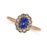 A SAPPHIRE AND DIAMOND CLUSTER RING in rose gold, set with an oval cabochon sapphire in a cluster...