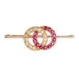 AN ANTIQUE RUBY AND DIAMOND CIRCLE BROOCH in 9ct yellow gold, designed as two interlocking circle...