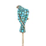 A FINE ANTIQUE VICTORIAN TURQUOISE EAGLE STICK PIN in yellow gold, the pin surmounted by an eagle...