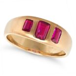 A VINTAGE RUBY GYPSY RING in yellow gold, set with three rectangular step cut rubies, the rubies ...