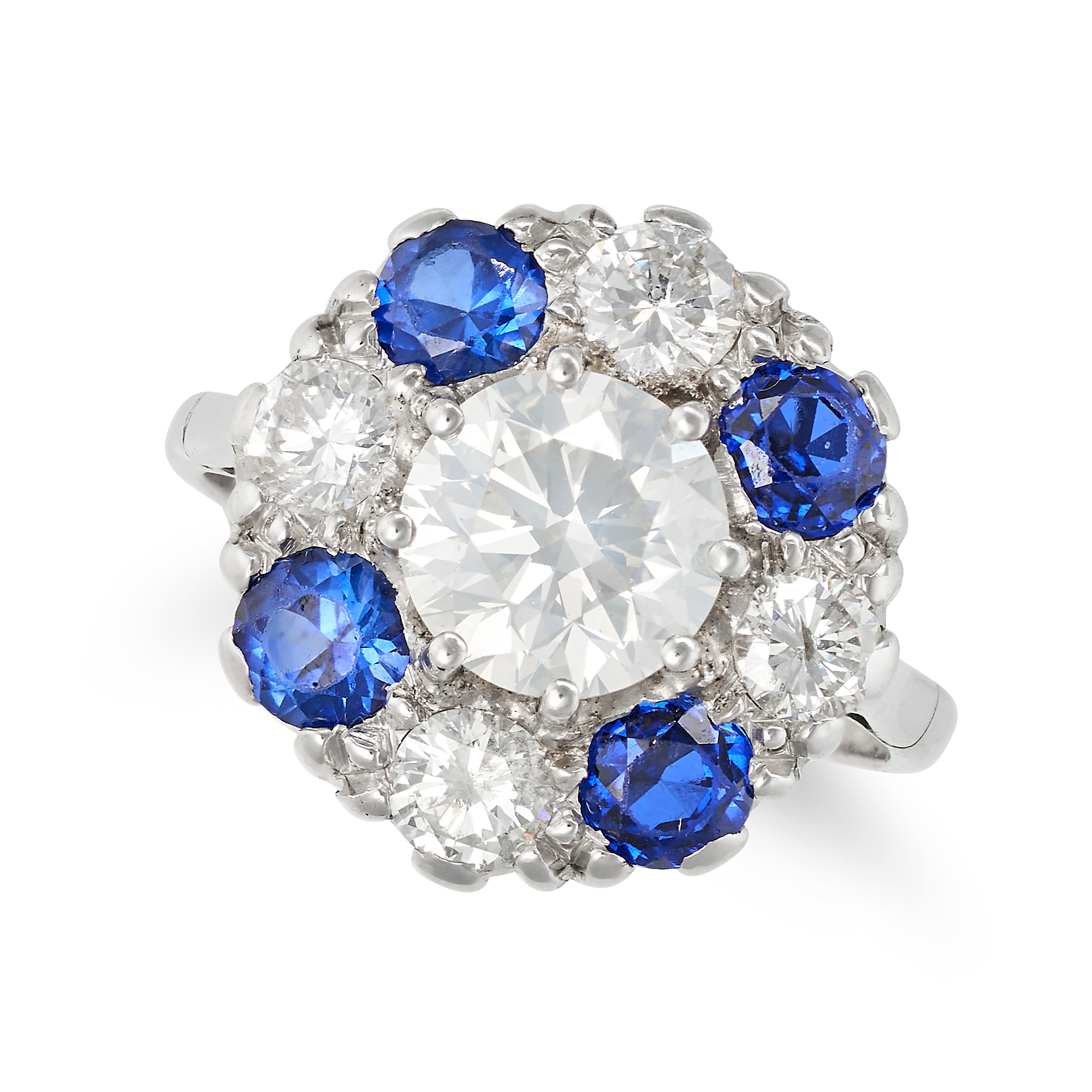 A DIAMOND AND SYNTHETIC SAPPHIRE CLUSTER RING in platinum and 18ct white gold, set with a round b...