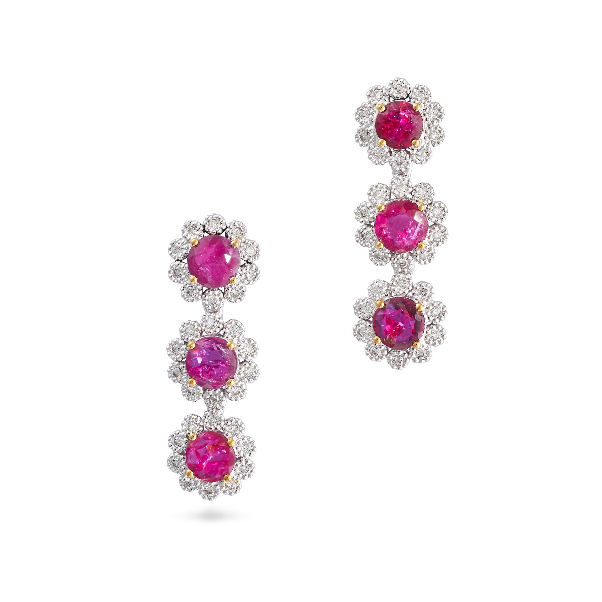 A PAIR OF RUBY AND DIAMOND CLUSTER DROP EARRINGS in 18ct white and yellow gold, each set with thr...