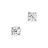 TIFFANY & CO., A PAIR OF SOLITAIRE DIAMOND STUD EARRINGS in platinum, each set with a round brill...