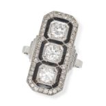 A DIAMOND AND ONYX DRESS RING set with three old European cut diamonds measuring approximately 0....