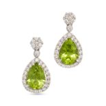 A PAIR OF PERIDOT AND DIAMOND DROP EARRINGS in 18ct white gold, each set with a cluster of round ...