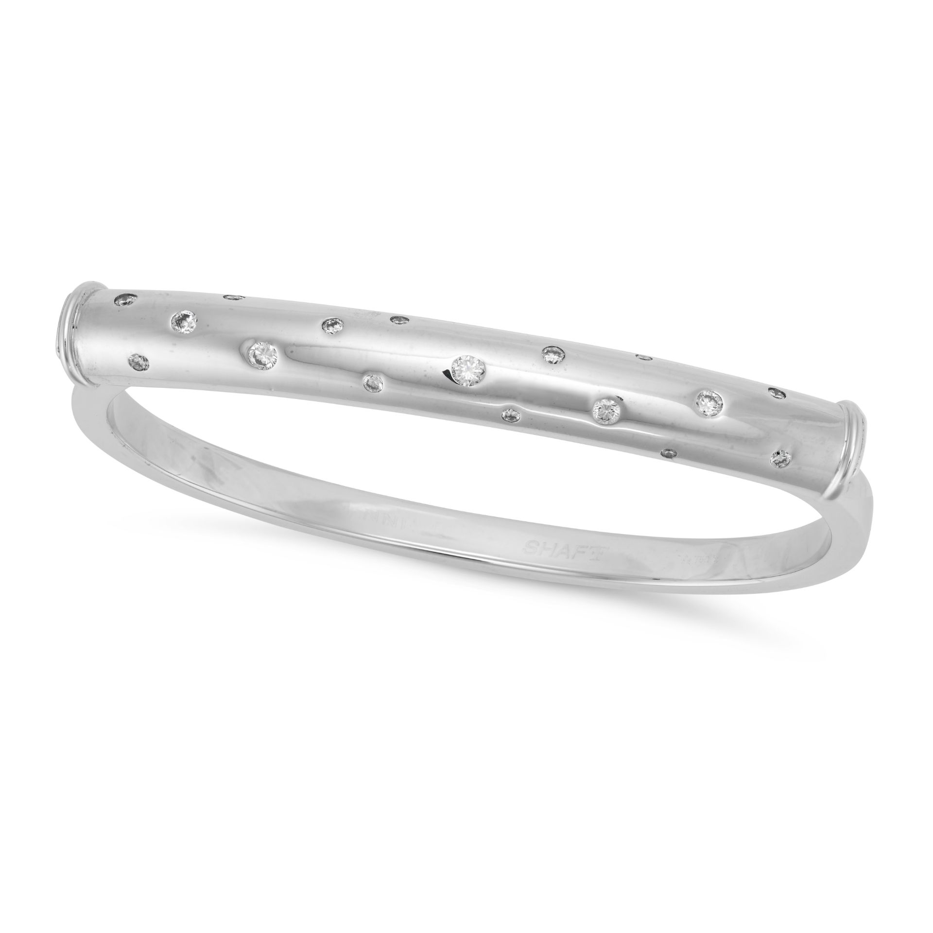 THEO FENNELL, A DIAMOND BANGLE in platinum, the hinged body set with round brilliant cut diamonds...
