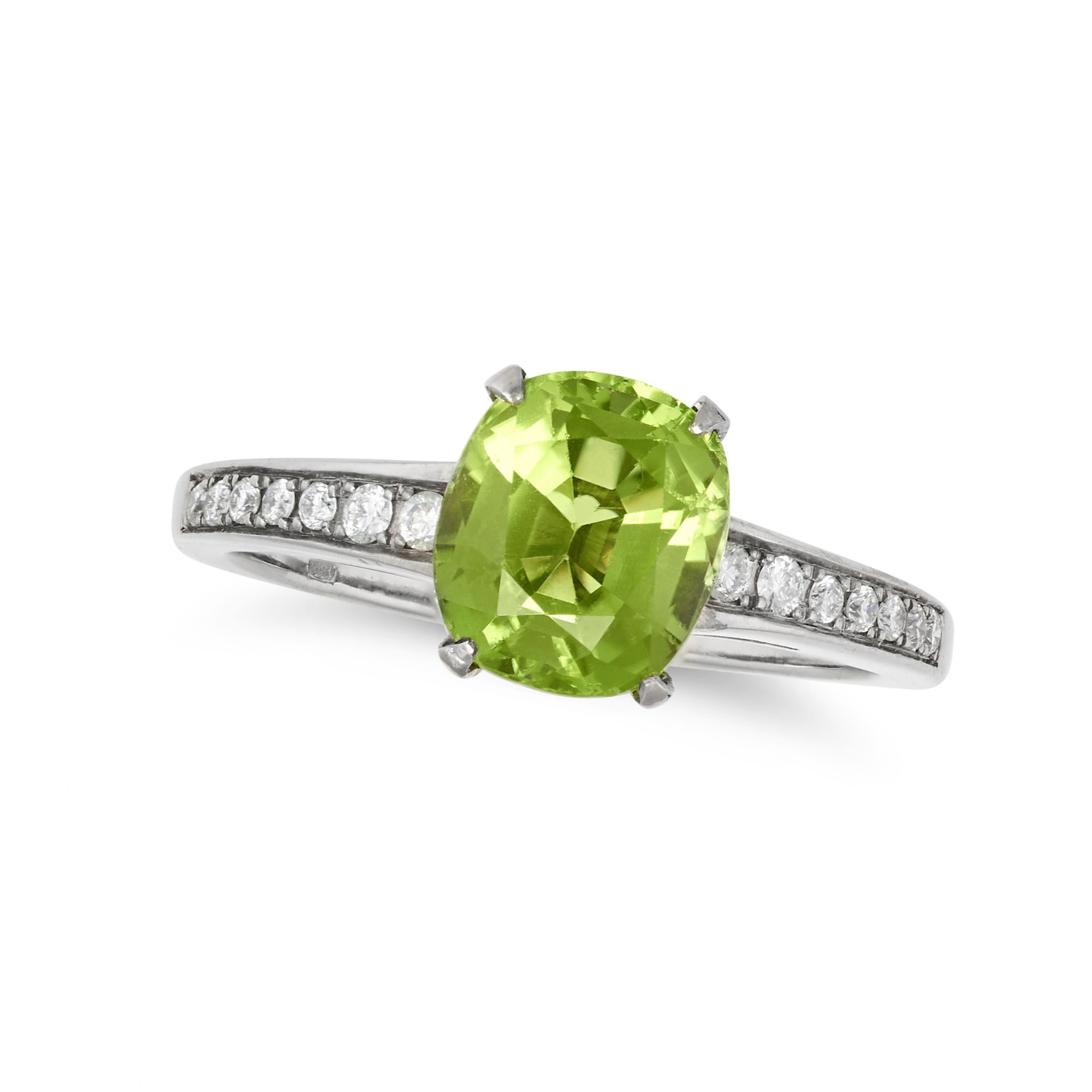 A PERIDOT AND DIAMOND RING in 18ct white gold, set with a cushion cut peridot of approximately 2....