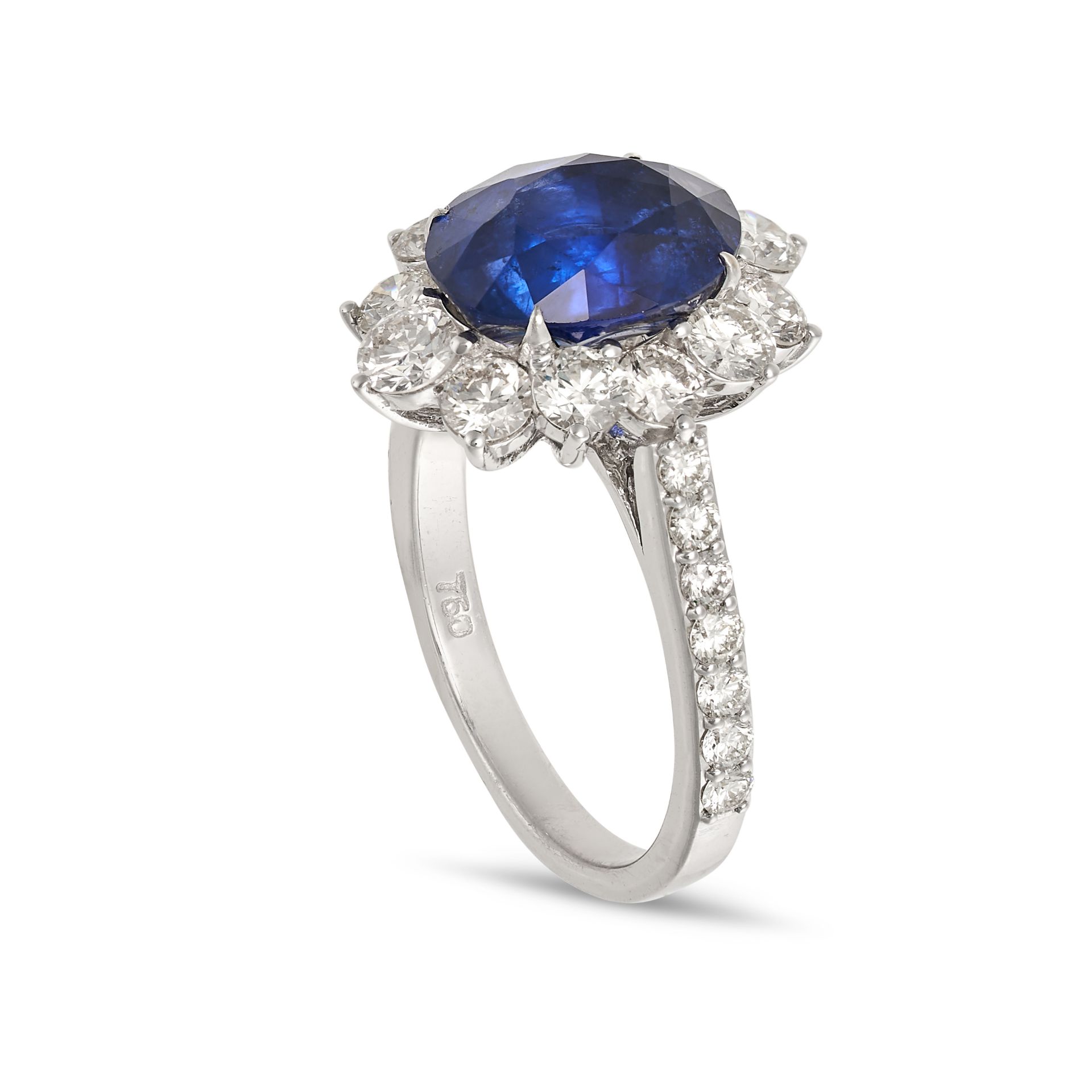 A SAPPHIRE AND DIAMOND CLUSTER RING in 18ct white gold, set with an oval cut sapphire of 4.53 car... - Image 2 of 2
