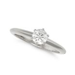 TIFFANY & CO., A SOLITAIRE DIAMOND ENGAGEMENT RING in platinum, set with a round brilliant cut di...