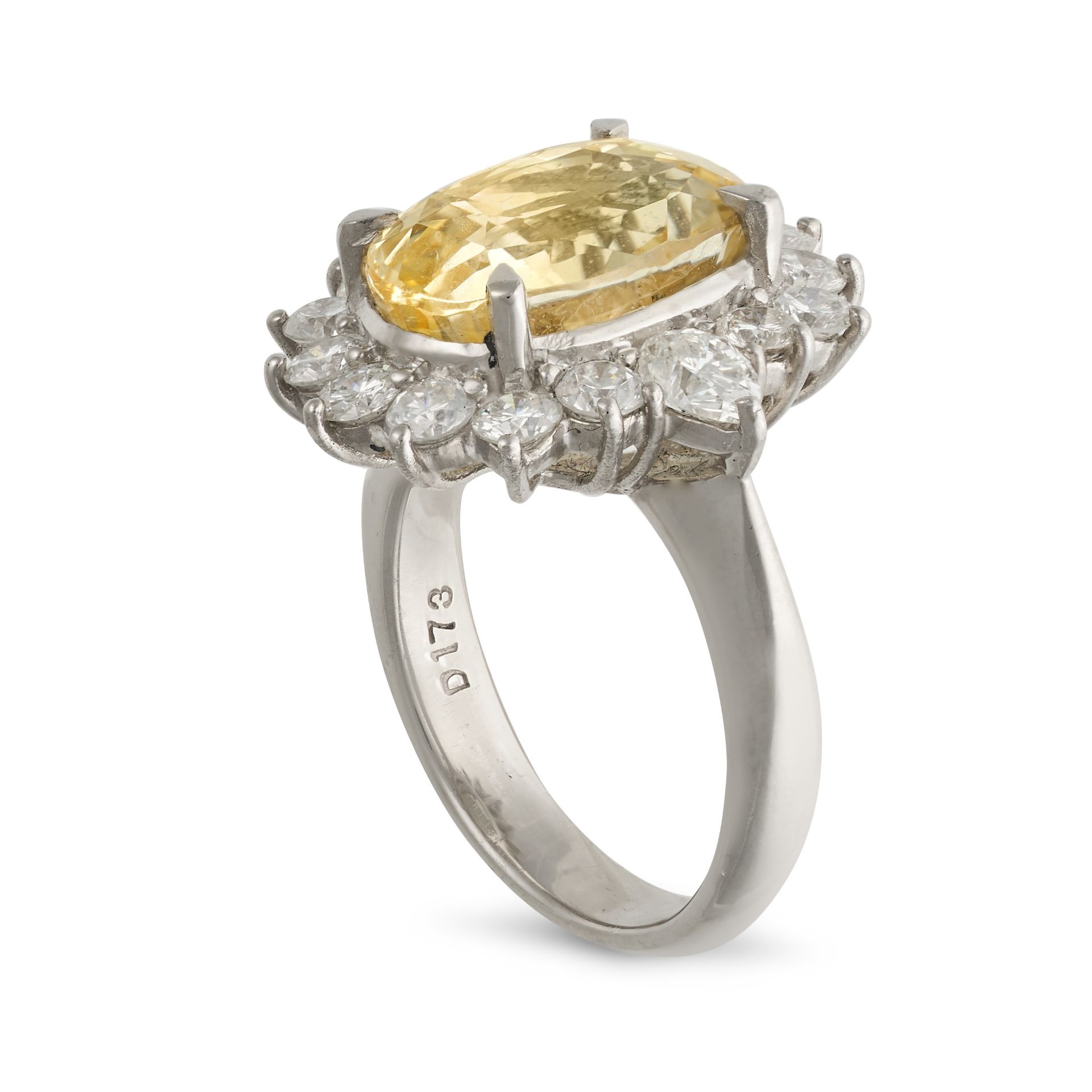 A YELLOW SAPPHIRE AND DIAMOND CLUSTER RING in platinum, set with an oval cut yellow sapphire of 7... - Image 2 of 2