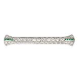 A DIAMOND AND EMERALD BAR BROOCH in platinum, set with a row of old cut diamonds accented by cali...