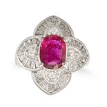 A RUBY AND DIAMOND CLUSTER RING in platinum, set with an oval cut ruby of 1.31 carats in a stylis...