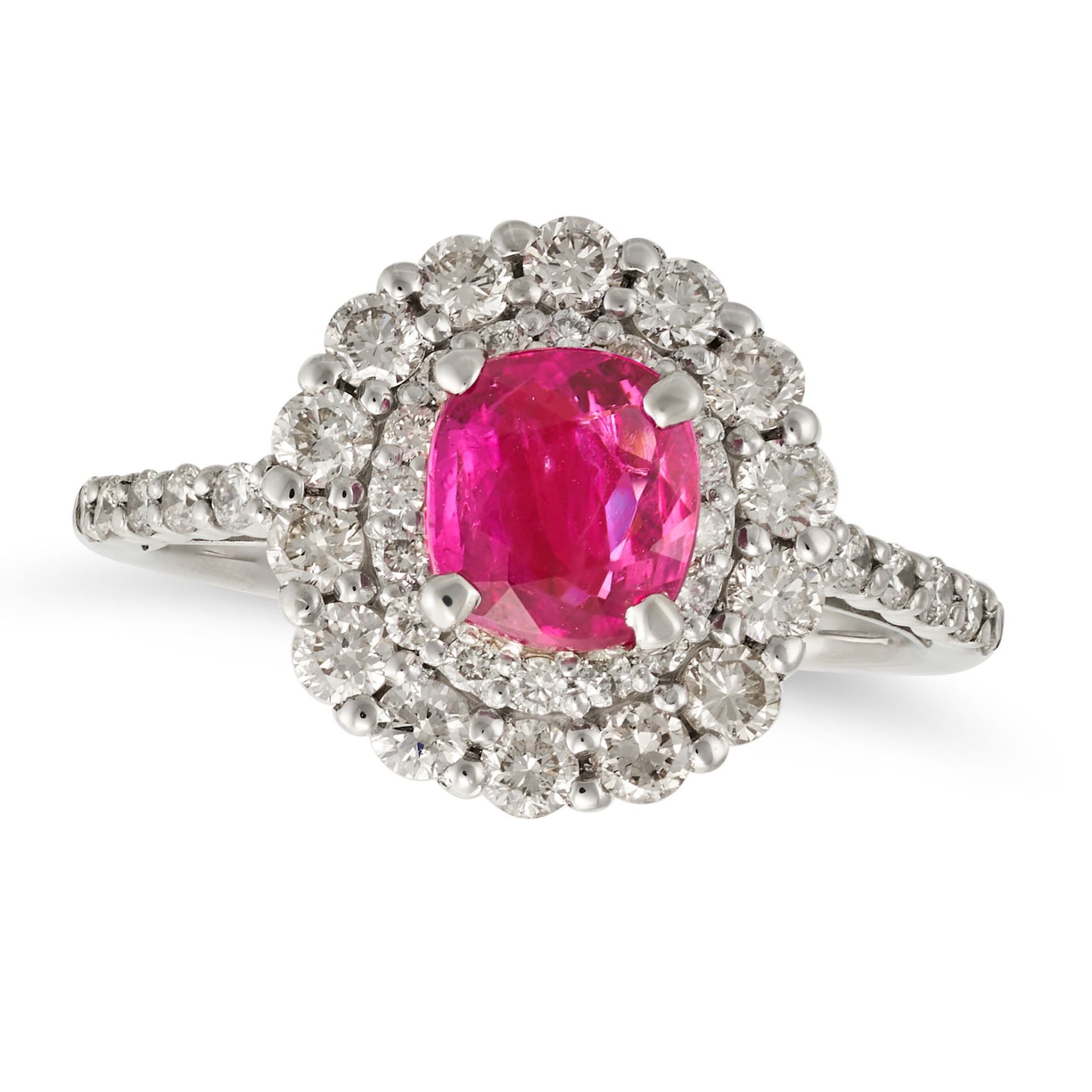 A RUBY AND DIAMOND CLUSTER RING in platinum, set with a cushion cut ruby of 1.05 carats in a doub...