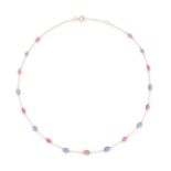 A TANZANITE AND PINK TOURMALINE CHAIN NECKLACE in 18ct yellow gold, the trace chain set with poli...