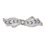 A VINTAGE DIAMOND & SYNTHETIC SAPPHIRE BOW BROOCH in platinum, set with a central old cut diamond...