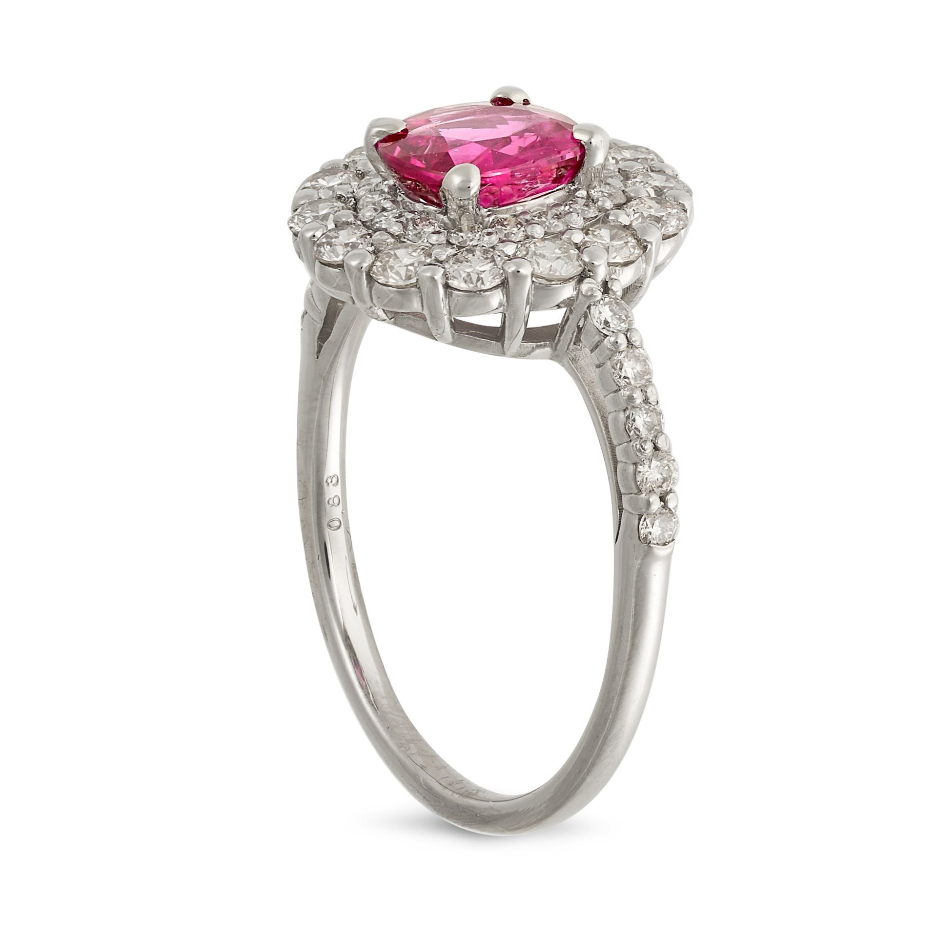 A RUBY AND DIAMOND CLUSTER RING in platinum, set with a cushion cut ruby of 1.05 carats in a doub... - Image 2 of 2