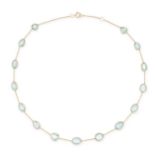 AN AQUAMARINE CHAIN NECKLACE in 18ct yellow gold, the trace chain set with fancy shaped rose cut ...