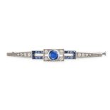 A SAPPHIRE AND DIAMOND BAR BROOCH in platinum, set to the centre with a round cut sapphire of app...