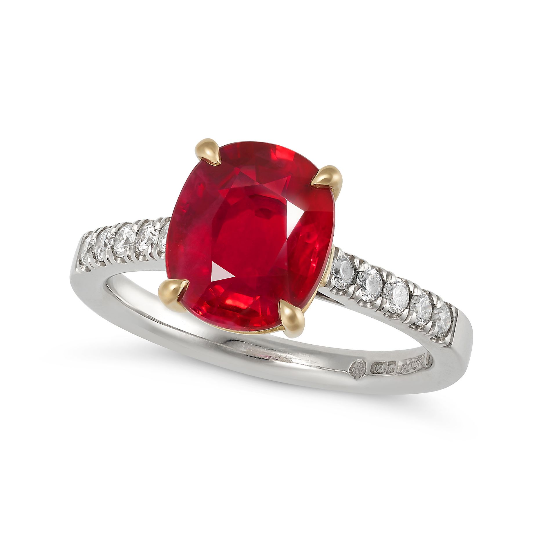 A PIGEON'S BLOOD BURMESE RUBY AND DIAMOND RING in platinum and 18ct yellow gold, set with a cushi...