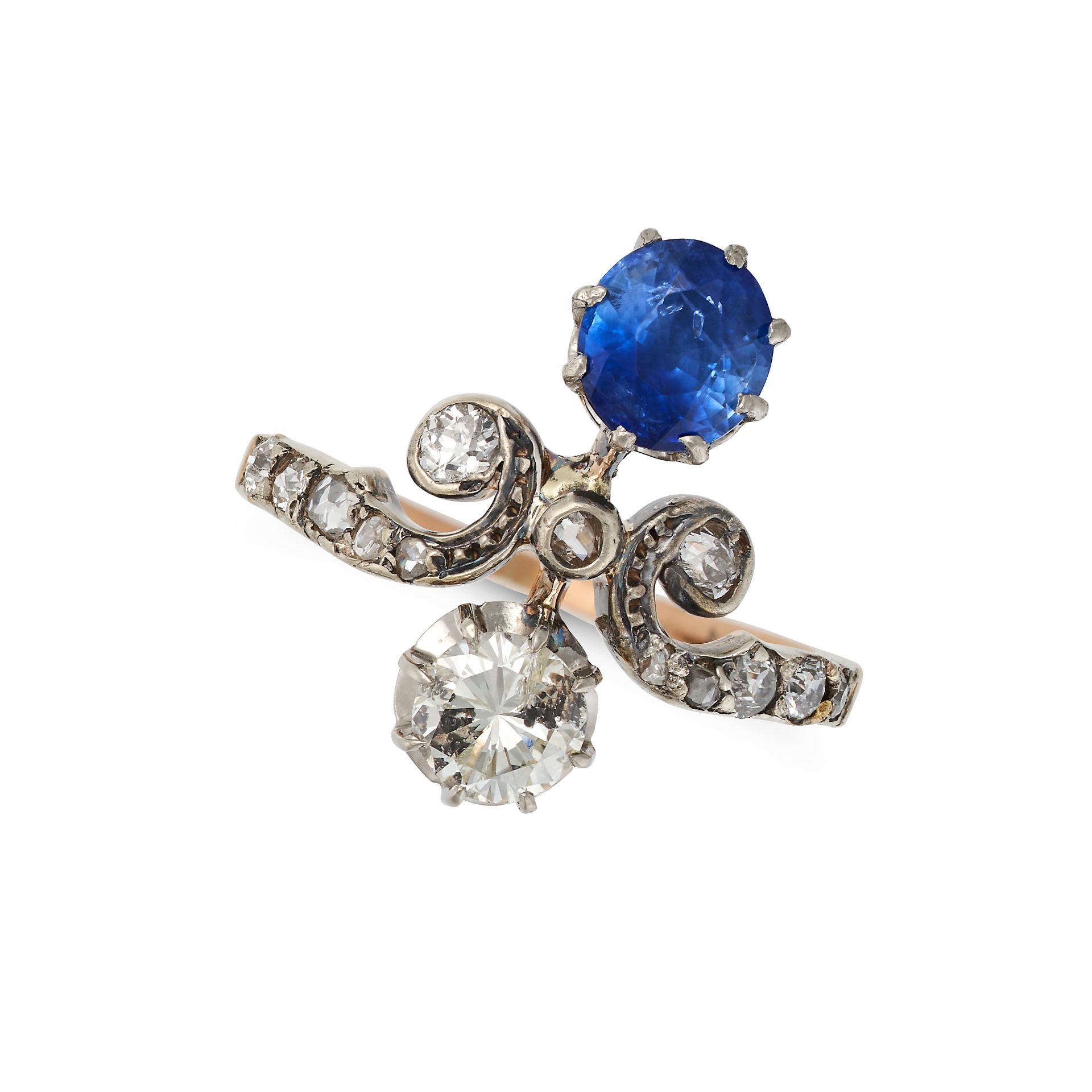 A SAPPHIRE AND DIAMOND TIARA RING in 18ct yellow gold, set with a round cut sapphire of approxima...