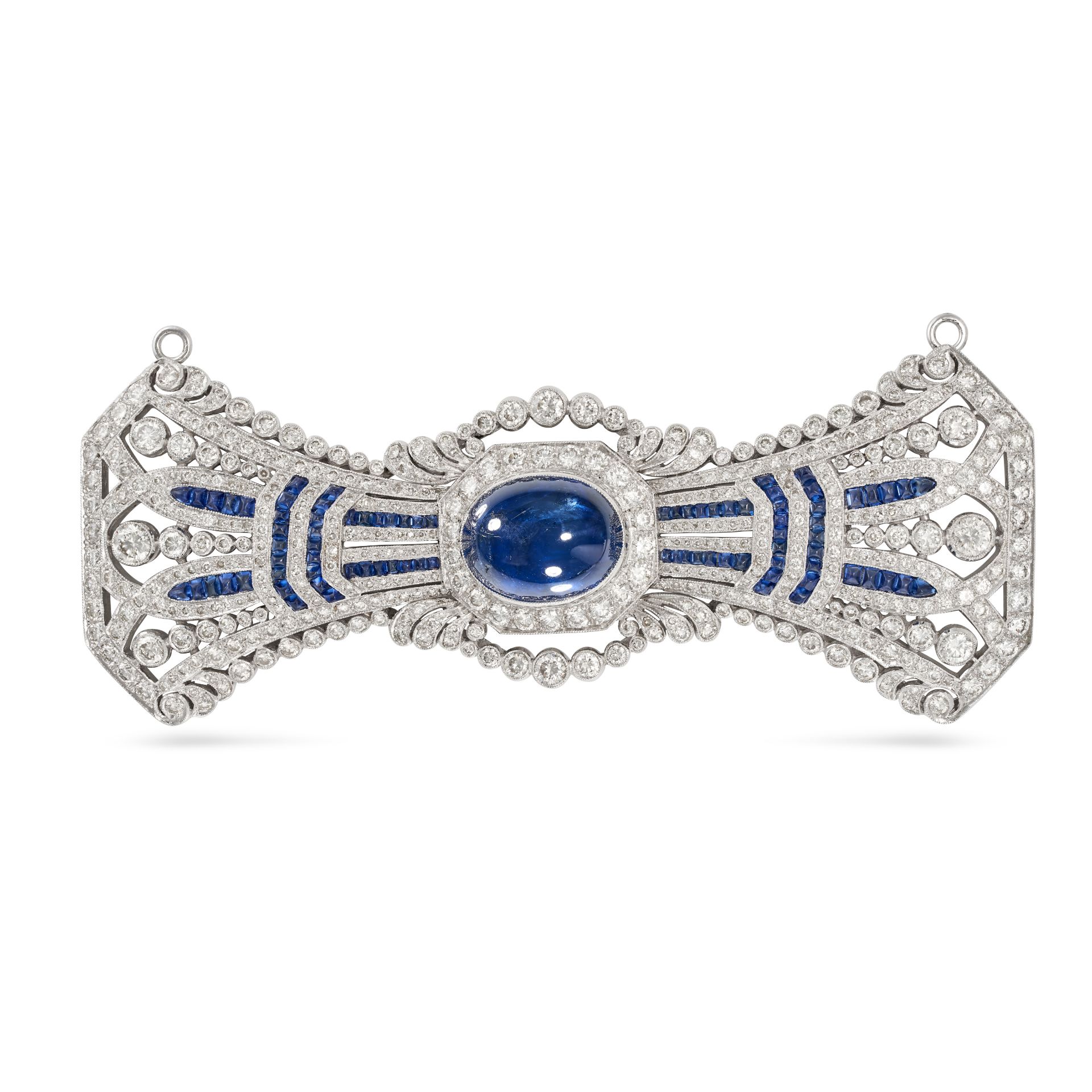 A SAPPHIRE AND DIAMOND BOW BROOCH in 18ct white gold, set to the centre with a cabochon cut sapph...