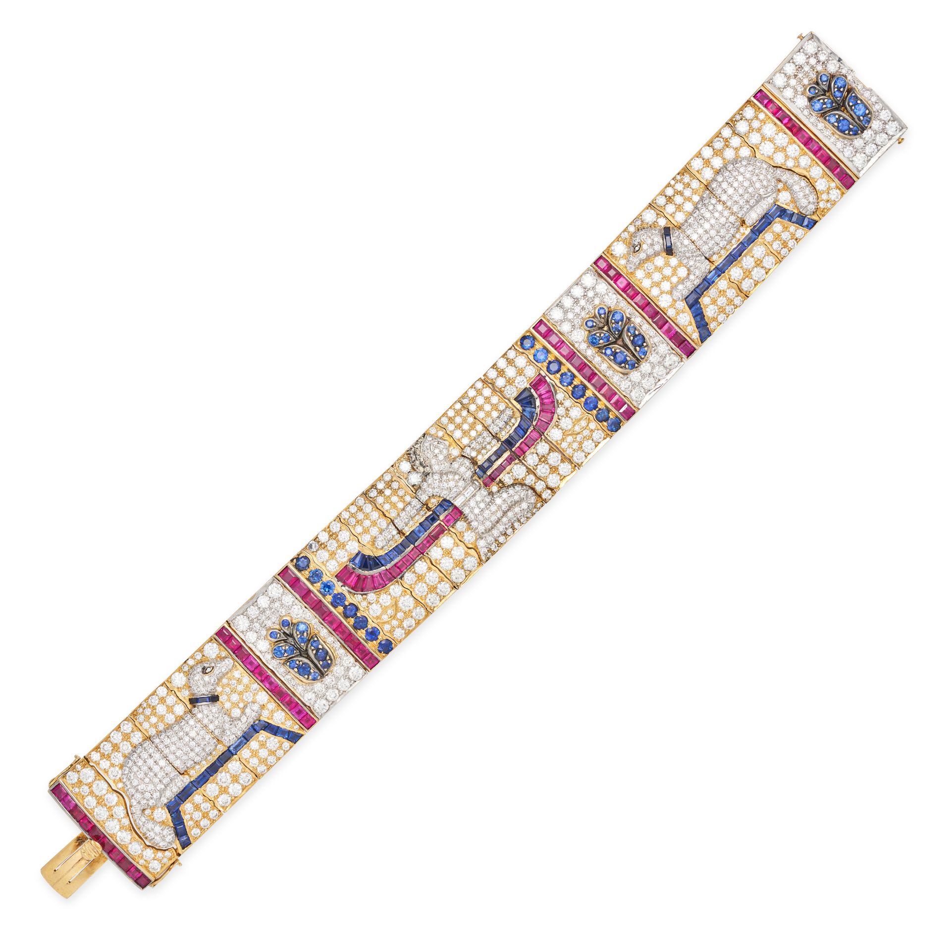 AN EGYPTIAN REVIVAL DIAMOND, SAPPHIRE AND RUBY BRACELET in 18ct yellow and white gold, the articu...